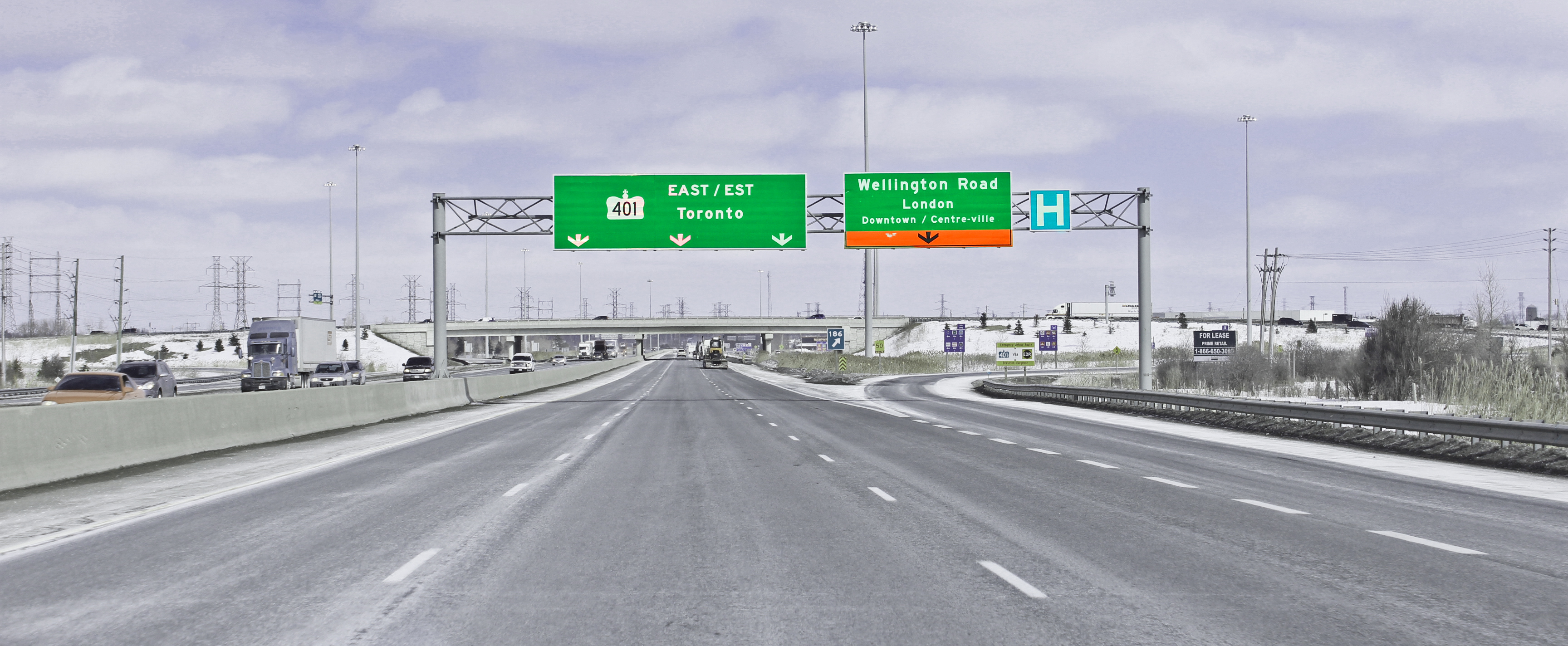 HoverWash drone cleaning a highway signage gantry